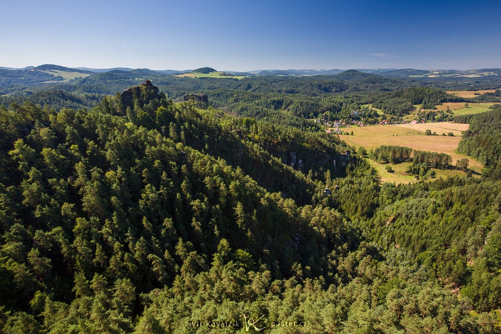 A 21mm focal length lens covering the meadow and the lookout tower on the opposite hill.