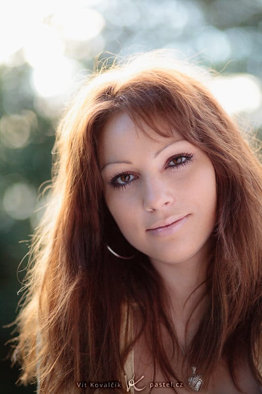 A portrait taken with the help of a reflector. The sun is right behind the model, and an assistant is holding a reflector from the opposite side. The reflector’s benefit is nicely visible in the model’s eye area. Canon EOS 5D Mark II, EF Canon 85 mm F1.8 USM, 1/1000 s, F1.8, ISO 100.