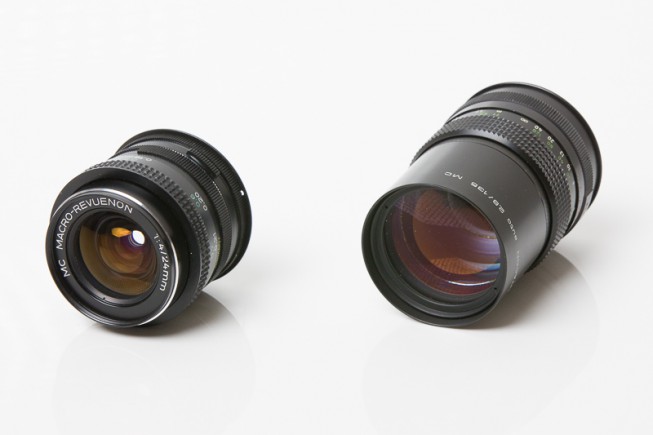 My Macro-Revuenon 24 mm F4, in fantastic condition (left), and my Pentacon 135 mm F2.8, with a few grains of dust inside. Both can be used with no problems.