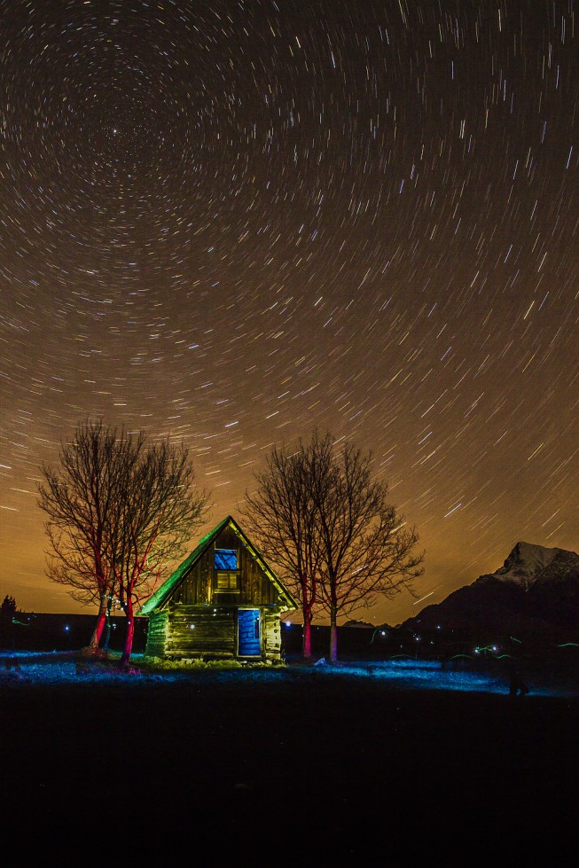 Here’s a photo that owes its life to several of the items above: a compass to find the North Star, a flashlight used together with flashes and colored filters to “color” the scene, and tape used like a cable trigger.