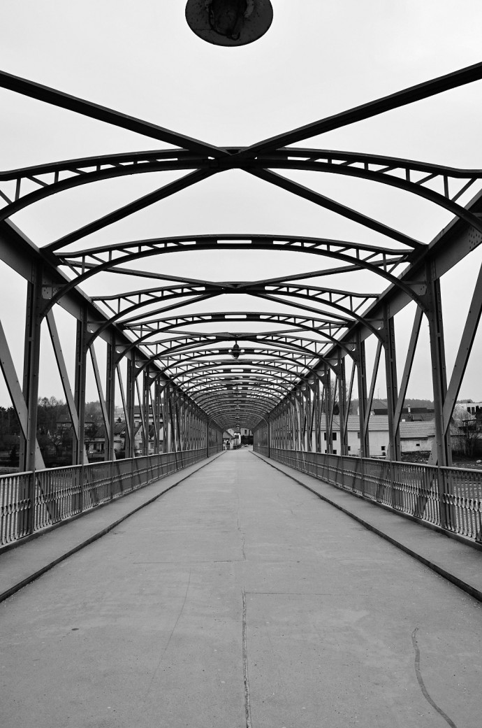 An emotional photo, where the black-and-white take simply fits. The aging bridge structure is an effective complement to the cracked asphalt. The black-and-white conversion is superb, with pitch-black blacks and ivory whites.