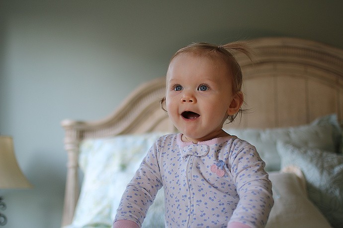 Bailey at 12 months. Bailey had only been awake for a few minutes when she was playing on mommy and daddy's bed with some great natural light. Please excuse the messy hair - the look on her face was too good to miss.