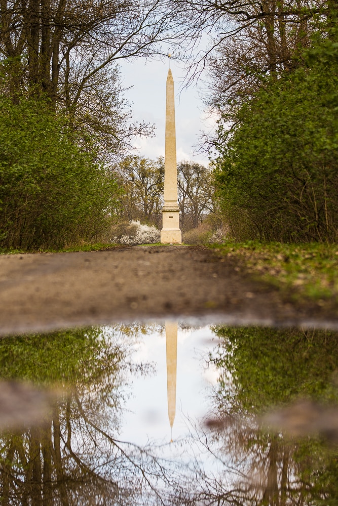 The Facka Obelisk at Lednice Palace, as reflected in a puddle. Canon 5D Mark II, Canon EF 70–200/2.8 IS II, 1/400 s, f/3.2, ISO 100, focus 100 mm 