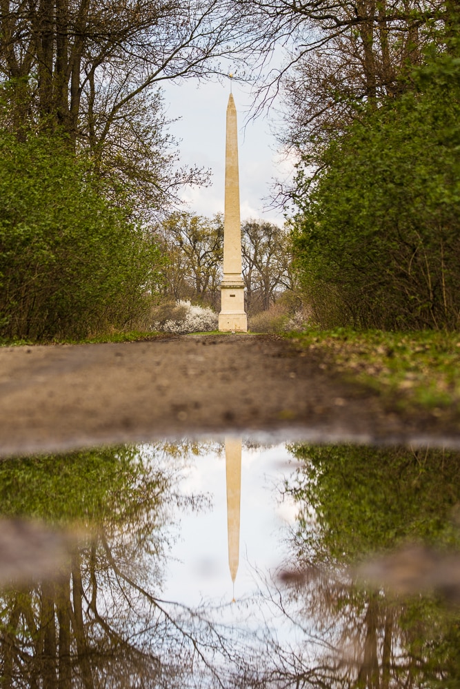 The Facka Obelisk at Lednice Palace, as reflected in a puddle. Canon 5D Mark II, Canon EF 70–200/2.8 IS II, 1/400 s, f/3.2, ISO 100, focus 100 mm