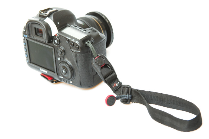 A wrist strap attached to a camera.