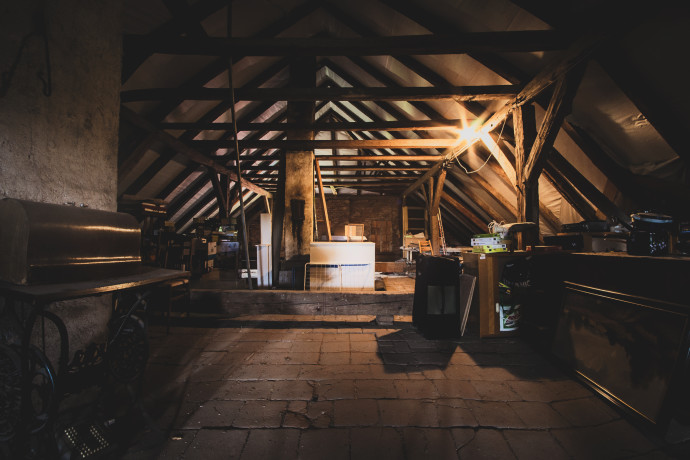 A dark photo in an attic.