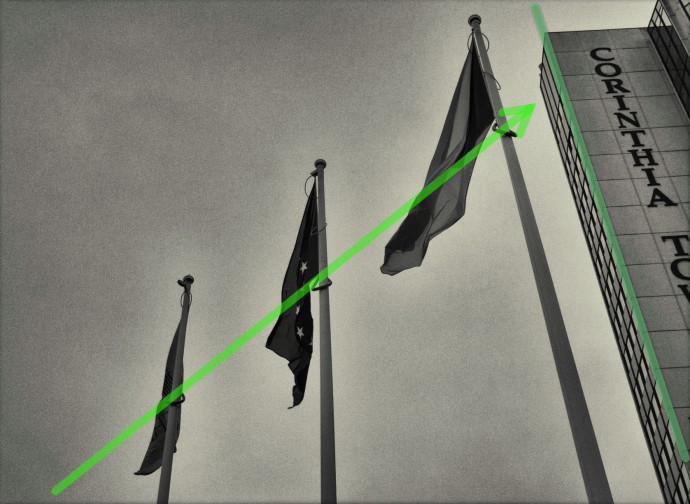 The imaginary guideline made up of the series of poles and flags leads your eyes through the picture. The nearly vertical line of the tall building brings them back to its main topic—the flags. Panasonic Lumix DMC-LX 3, 1/500 s, f/2.8, ISO 200, focus 10.2 mm (48 mm equiv.)