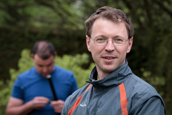 This portrait that’s not in Portrait orientation works out well because the main subject, composed to the right third of the photo, is balanced out by another man in the background on the left. Canon EOS 7D, 70-200/2.8, 1/640 s, f/4.0, ISO 400, focus 91 mm (145 mm equiv.) 