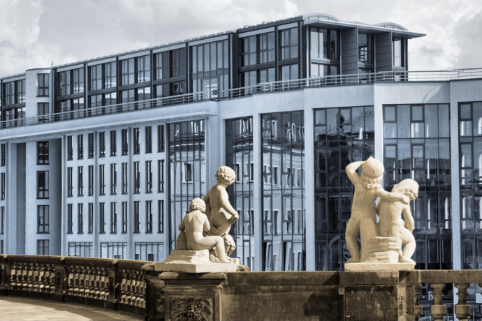 I enhanced the contrast of meaning here (baroque-era statues looking at a modern building) by converting the photo to black-and-white and applying selective coloring (warm vs. cool colors). Canon EOS 400D, EF 24-80/3.5-5.6 USM, 1/250 s, f/10, ISO 400, focus 53 mm (85 mm equiv.) 