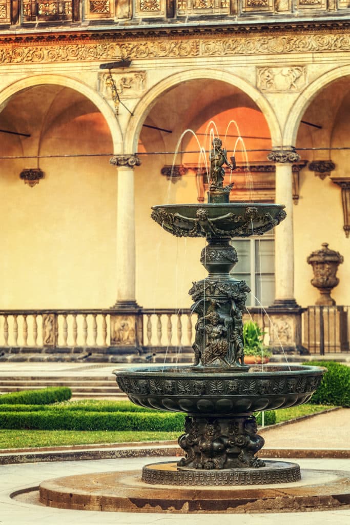 I photographed this fountain at sunset. The last shreds of warmly colored light are visible at the top. The fountain itself has fallen into shadow, and so it’s drawn with fairly soft light. Canon EOS 5D MkII, 70-200/2.8, 1/125 s, f/4.0, ISO 100, focal length 135 mm 