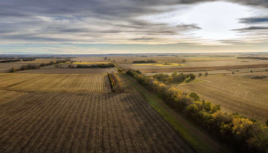 Aeria panoramic view of South Dakota farm land painted with the sunrise and autumn colors.