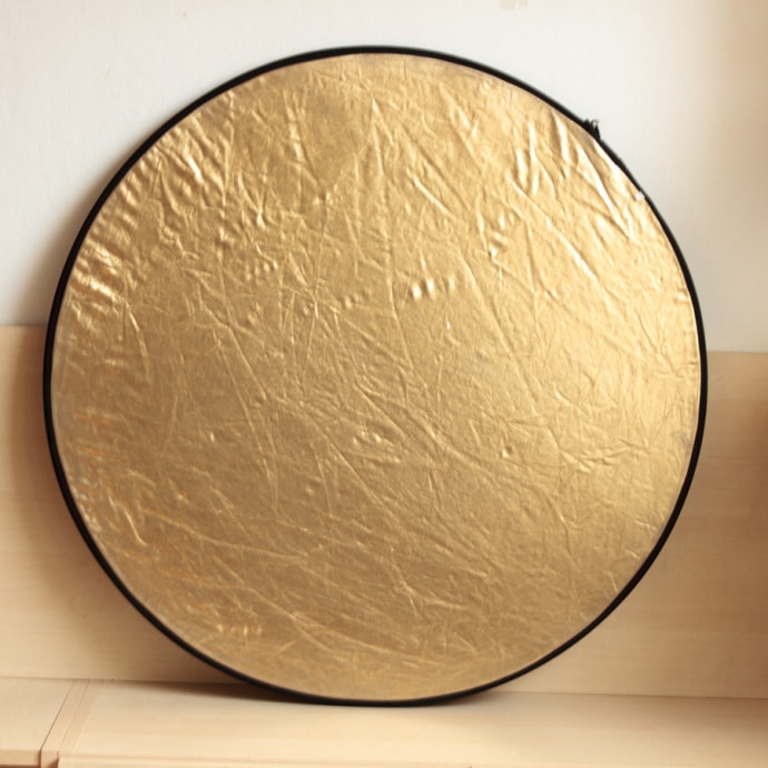 Use a gold reflector to make natural light warmer. But don’t overdo it; the effect is fairly strong. Ideally you want to simulate the evening light during daytime.