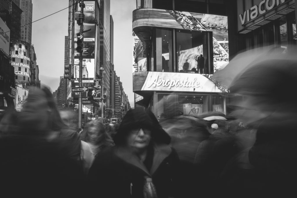 Head straight out into the crowd and try taking a motion-filled street portrait. Canon EOS 100D, EF-S 24mm f/2.8 STM, 0,8 s, f/22, focal length 24 mm 