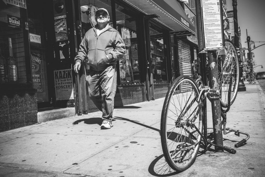 I took this picture on bended knees. Notice how the shot angle lets you look directly under the man’s cap into his frowning face. Canon EOS 100D, EF-S24mm f/2.8 STM, 1/200 s, f/8, ISO 100, focal lenght 24 mm (38 mm)