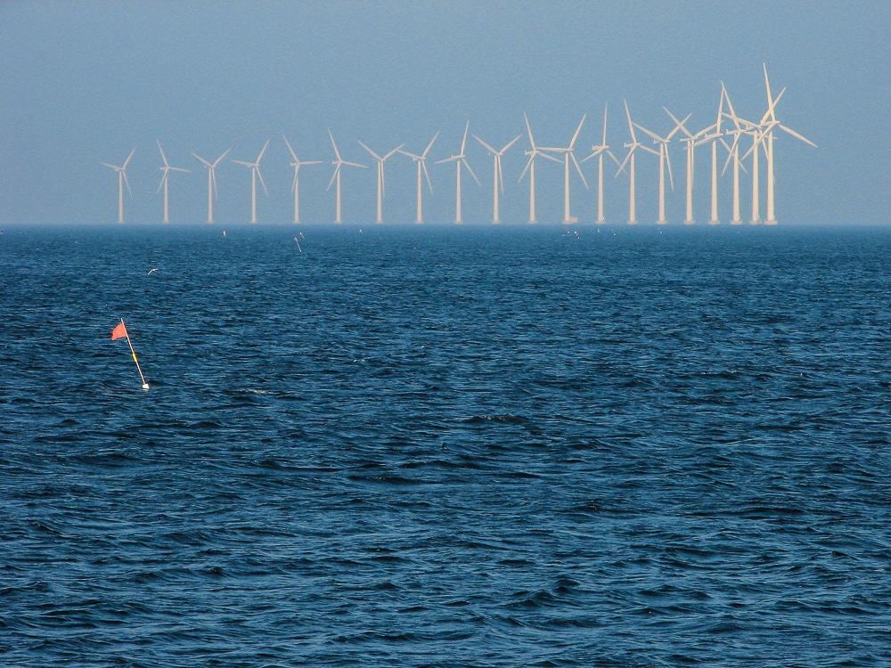 Danish wind power plants by the shore. Canon PowerShot S2 IS, 1/320 s, f/6.3, focal length 39.1 mm (about 235 mm full-frame equivalent).