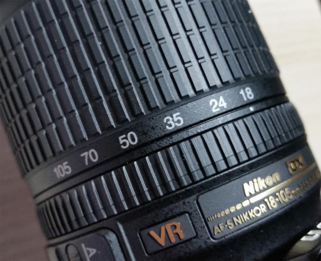 The numbers on the lens represent the lens’s focal length in millimeters.