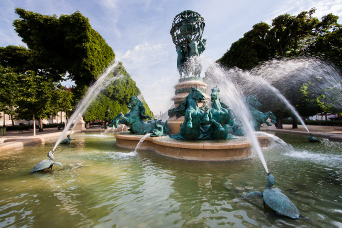 A fountain photographed facing away from the sun.