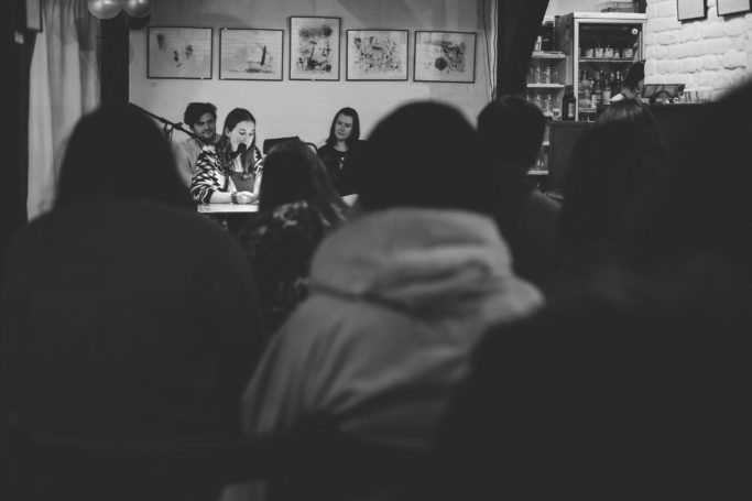 7 Challenges of Reportage Photography: author reading her book.