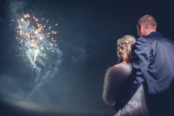 Learn the Right Way to Photograph Fireworks: Wedding fireworks with improvised lighting from a phone.