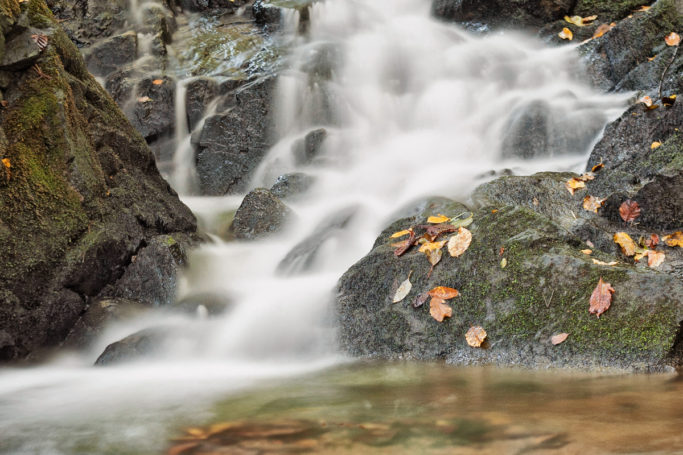 How to photograph motion: An autumn waterfall shot with a long exposure.