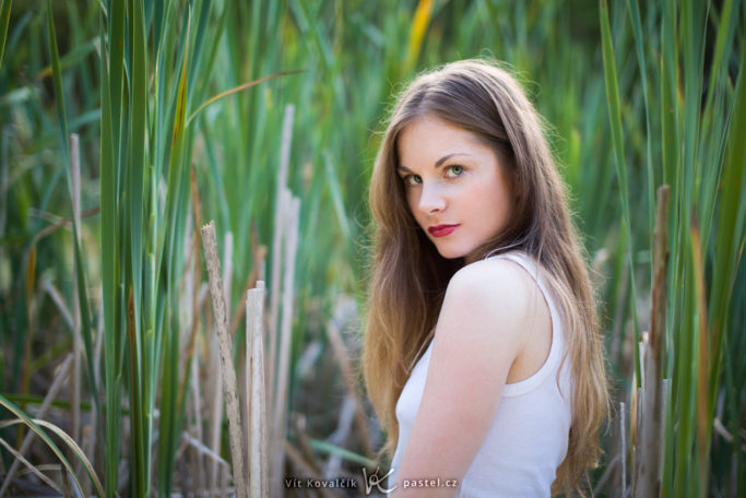 portrait with a dark background.