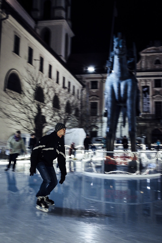 Discover the Wonders of Winter City Photography: panning photo of a skater.