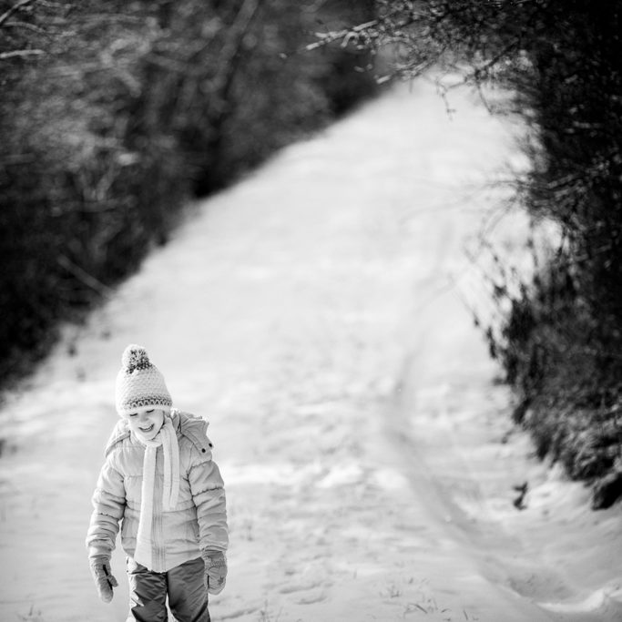 How to Photograph Children in Winter: child on a winter road.