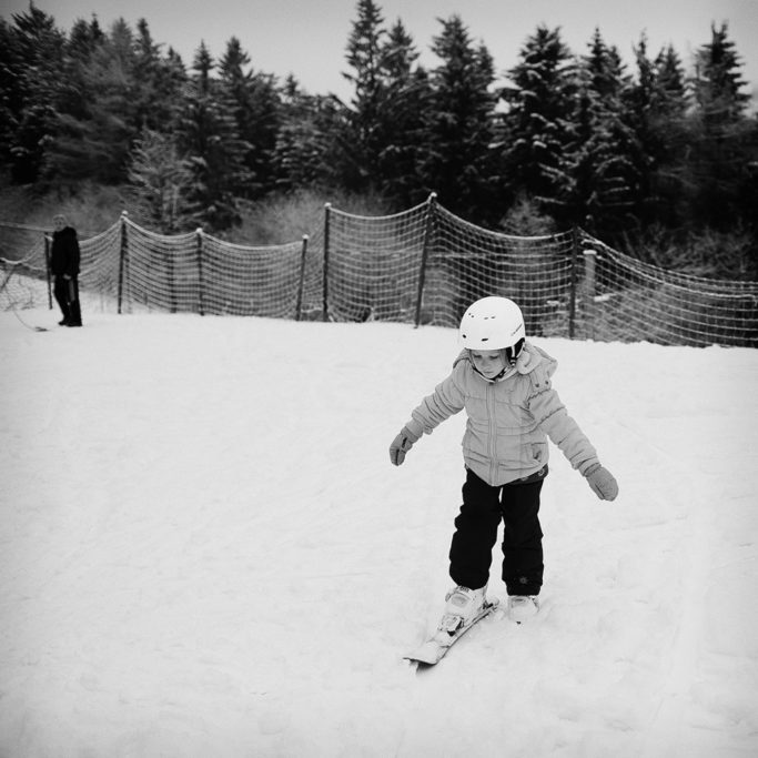 How to Photograph Children in Winter: A child’s first time with skis.