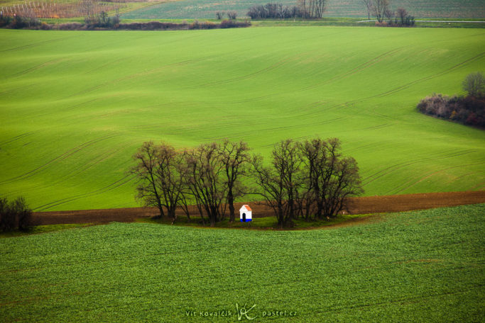 Benefits of Telephoto Lenses for Landscapes: a photo of a chapel with distracting areas.