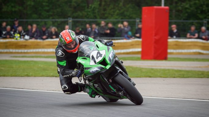 How to Photograph Motorcycles: a motorcycle heading out of a bend.