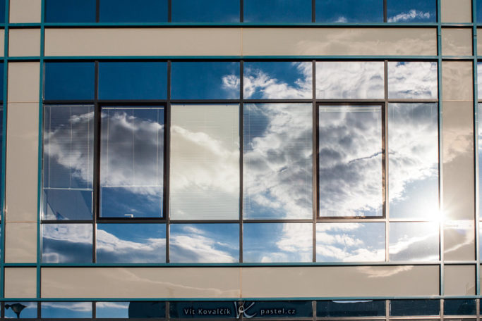 How to Photograph with the Sun in the Frame: reflection of a sun in the window.