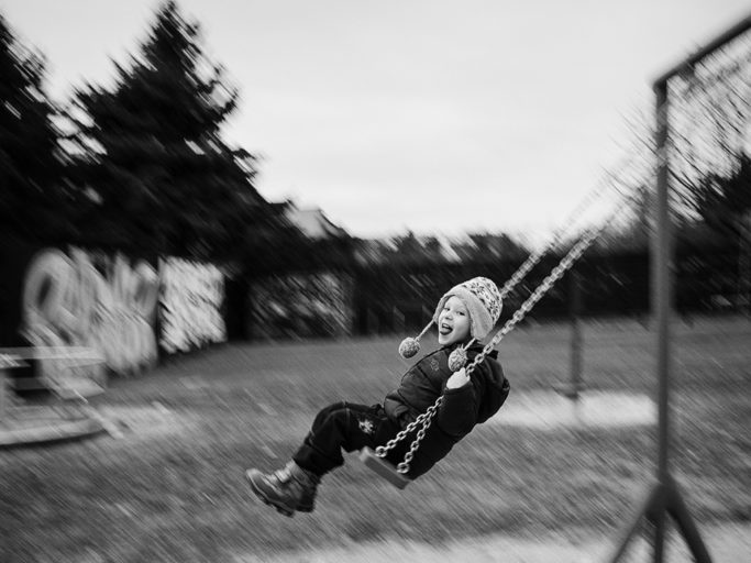 Photographing kids with longer exposure: panning on a playground.