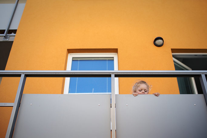 Photographing Kids in Color and Black and White: a child on the balcony.