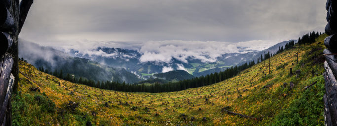 Photographing landscapes in rain and shine: a panorama of a rainy landscape.