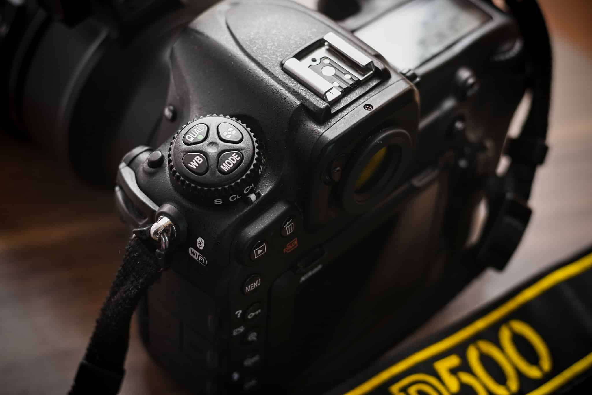 Choosing Sports Photography Gear I: Picking a Camera The MODE button on the Nikon D500.