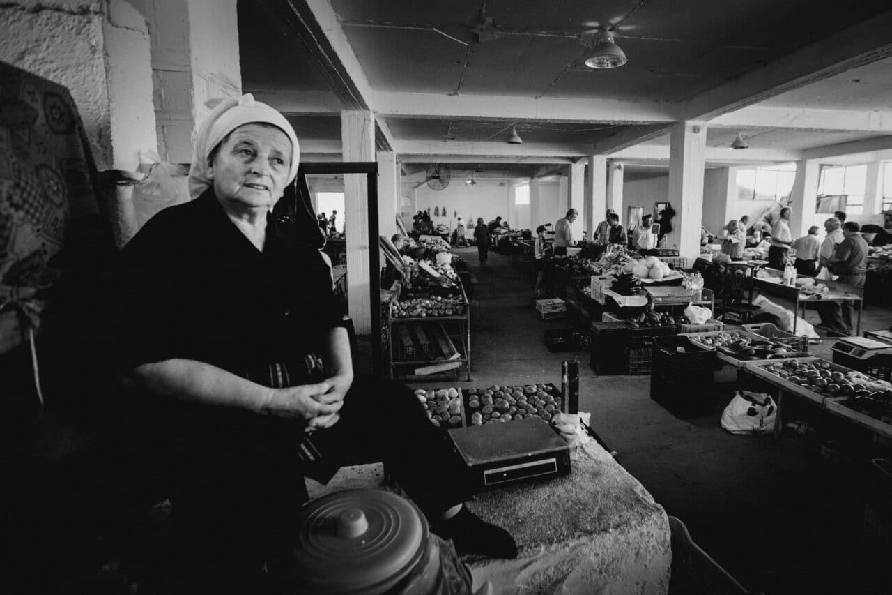 street market, inside, woman, black and white