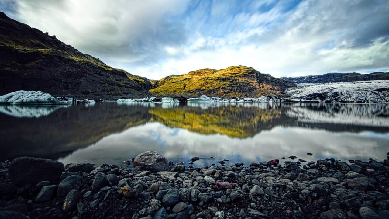 Glacial lake. A long shutter speed makes the surface look like a mirror and the ripples disappear (shutter speed increased to 30s using an ND 2000 filter).
