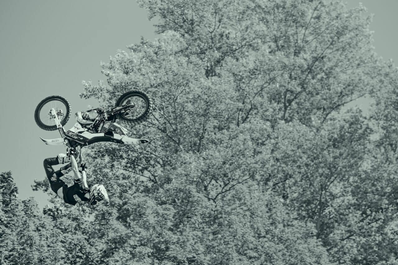 car photo, galerie, Frozen motion. The short shutter speed of 1500s was enough to freeze the motion of the motorcycle and rider. I used this composition where the rider appears to “fall out” of the picture to